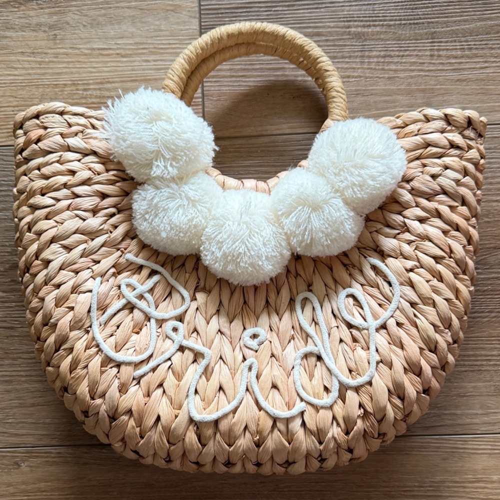 “Bride” Woven Straw Pom-Pom Tote Bag in Natural